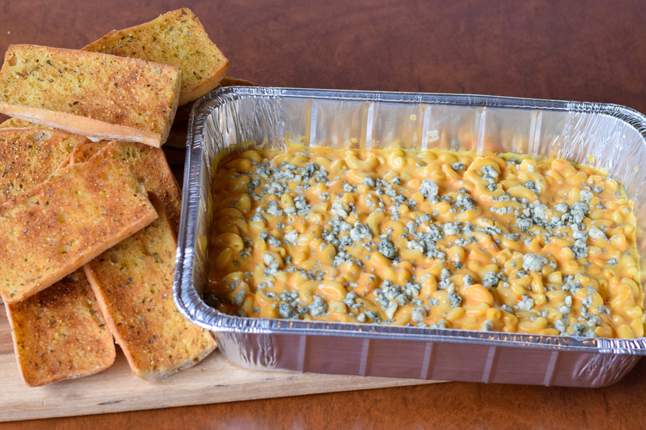 MenuItem-Catering-BuffMacCheesePan-1280x853 Pan of cheesy mac and cheese noodles mixed with buffalo sauce and topped with gorgonzola cheese served with ciabatta garlic toast.