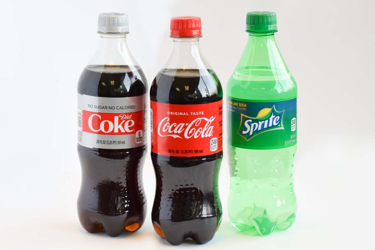 Three 20 ounce bottled beverages diet coke, coca-cola, and sprite
