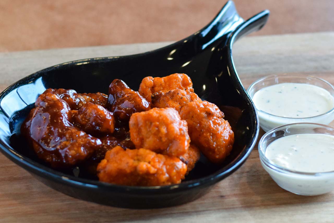 Boneless style wings tossed in bar-b-que and buffalo sauce with a side of ranch dressing.